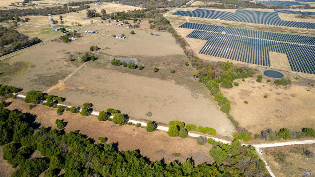 8908 Southwest County Road 2110 Wortham, TX 76693 - Photo 2 of 11 a view of a yard with wooden fence