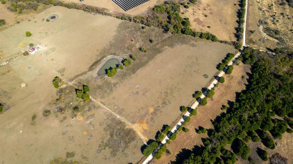 8908 Southwest County Road 2110 Wortham, TX 76693 - Photo 10 of 11 a view of a flower in a yard