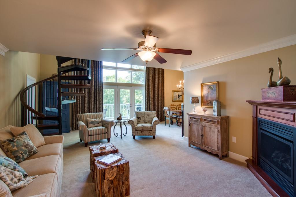 7100 Dale Ridge Road, Unit K6 Lancaster, TN 38569 - Photo 2 of 30 Light from the two-story windows fills this spacious living area