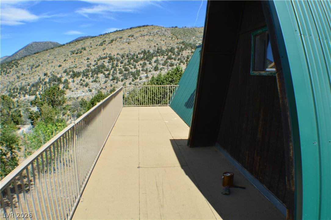 1321 Trout Canyon Road Las Vegas, NV 89124 - Photo 40 of 50 Perched on a mountainside, this expansive deck offers inspiring panoramic views.