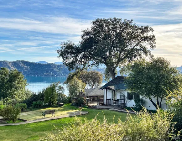 a swimming pool view with a lake view