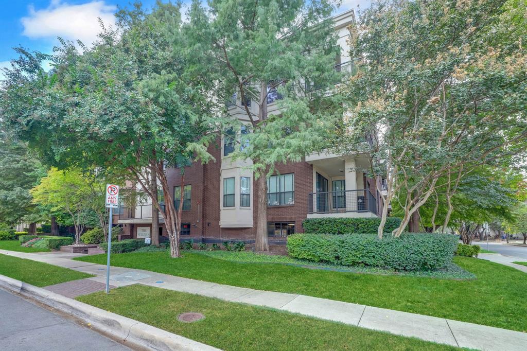 4333 Gilbert Avenue, Unit 215 Dallas, TX 75219 - Photo 18 of 19 a front view of a house with a yard