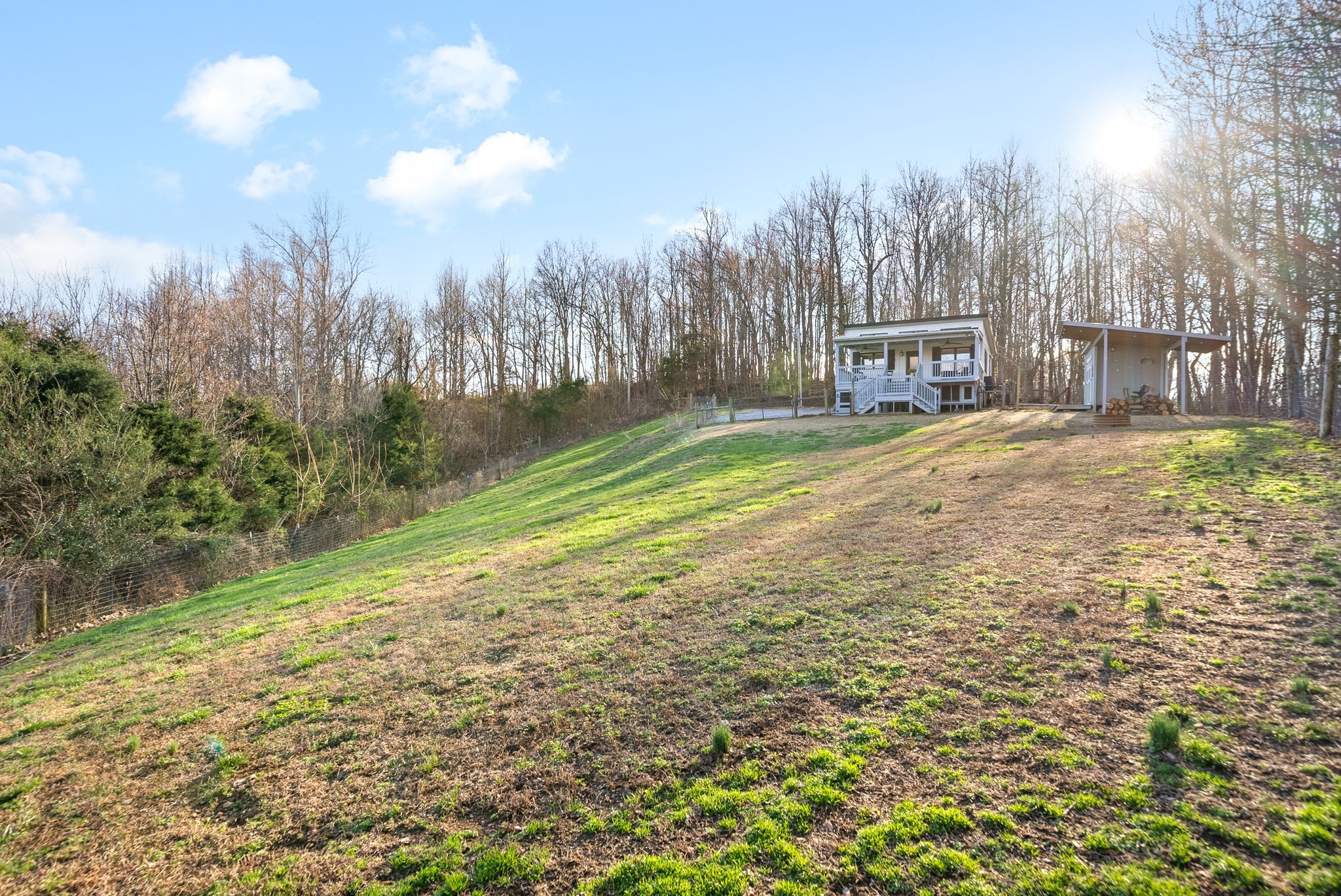 1166 Dale Ridge Road Dowelltown, TN 37059 - Photo 19 of 69 a view of a yard with a house in the background