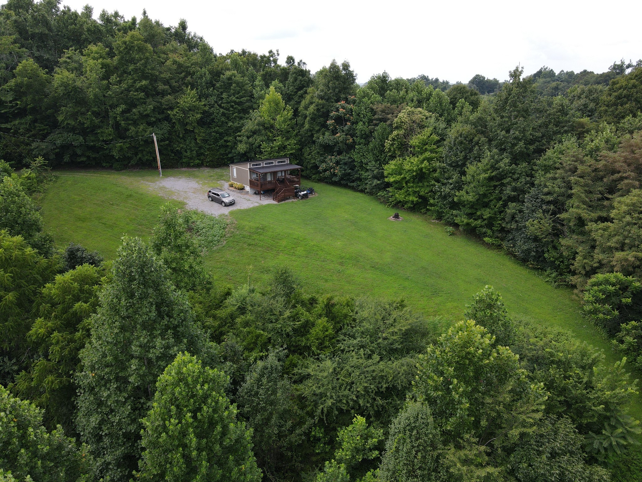1166 Dale Ridge Road Dowelltown, TN 37059 - Photo 33 of 69 a view of a backyard with large trees