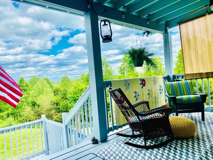 1166 Dale Ridge Road Dowelltown, TN 37059 - Photo 47 of 69 a balcony with chairs and a potted plant