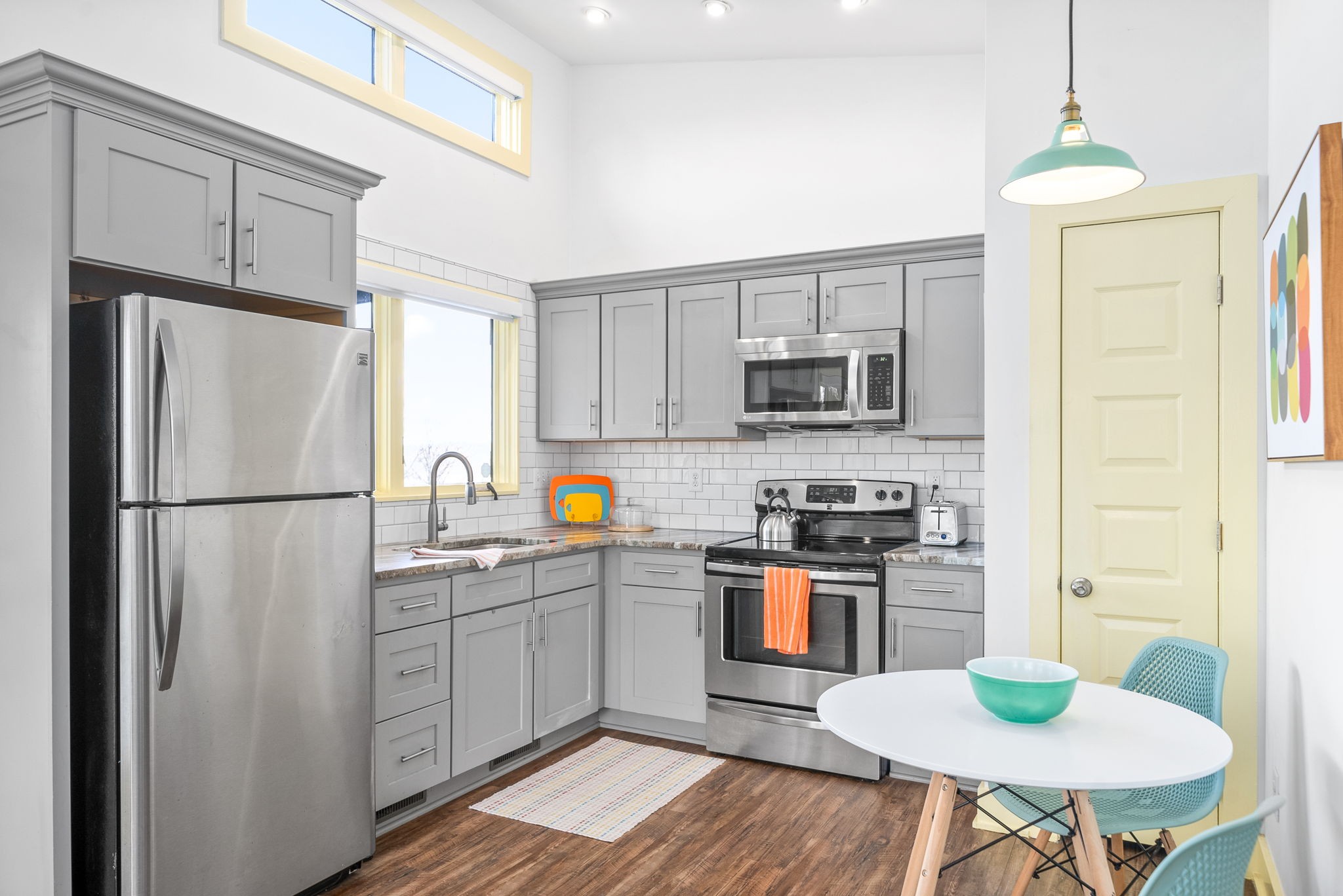 1166 Dale Ridge Road Dowelltown, TN 37059 - Photo 8 of 69 a kitchen with stainless steel appliances a refrigerator stove microwave and white cabinets