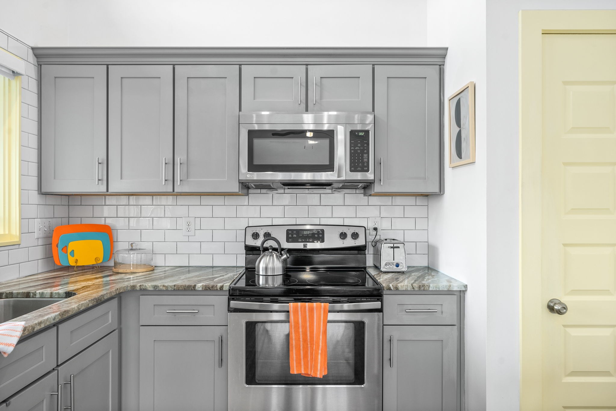 1166 Dale Ridge Road Dowelltown, TN 37059 - Photo 9 of 69 a kitchen with stainless steel appliances granite countertop a stove a sink and a microwave