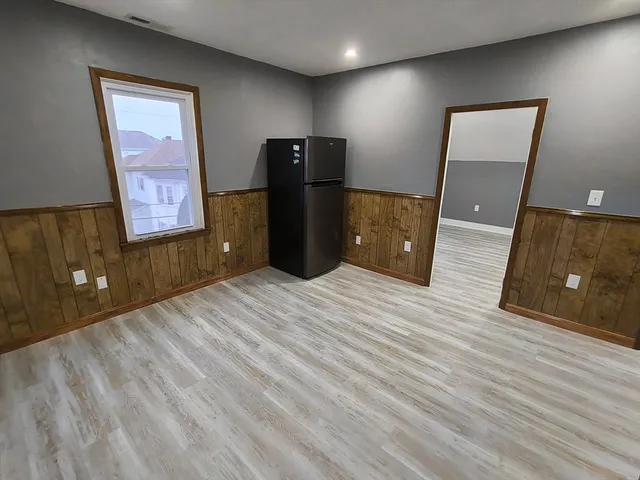 a bedroom with a bed and a desk