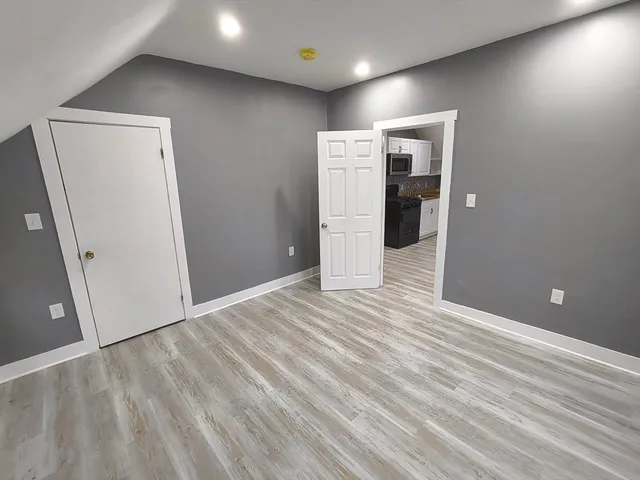 a view of a livingroom with wooden floor