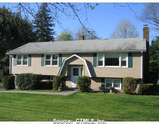 24 Hillfield Road Hamden, CT 06518 - Photo 1 of 1 a front view of a house with a garden