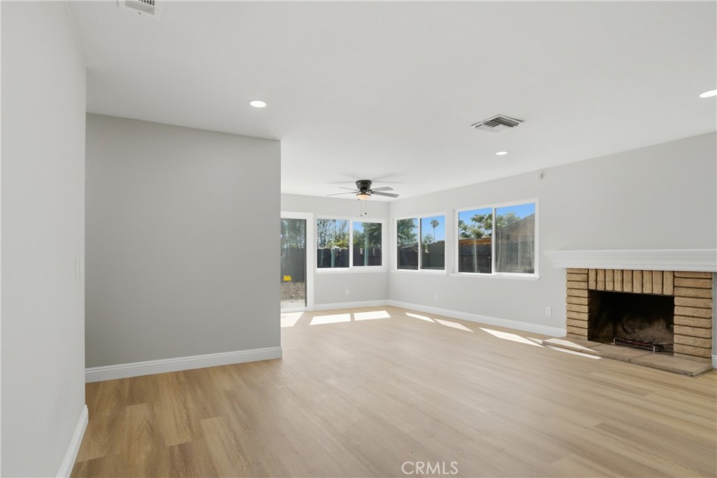 2924 Louisiana Place Riverside, CA 92506 - Photo 8 of 42 a view of an empty room with a fireplace and a window