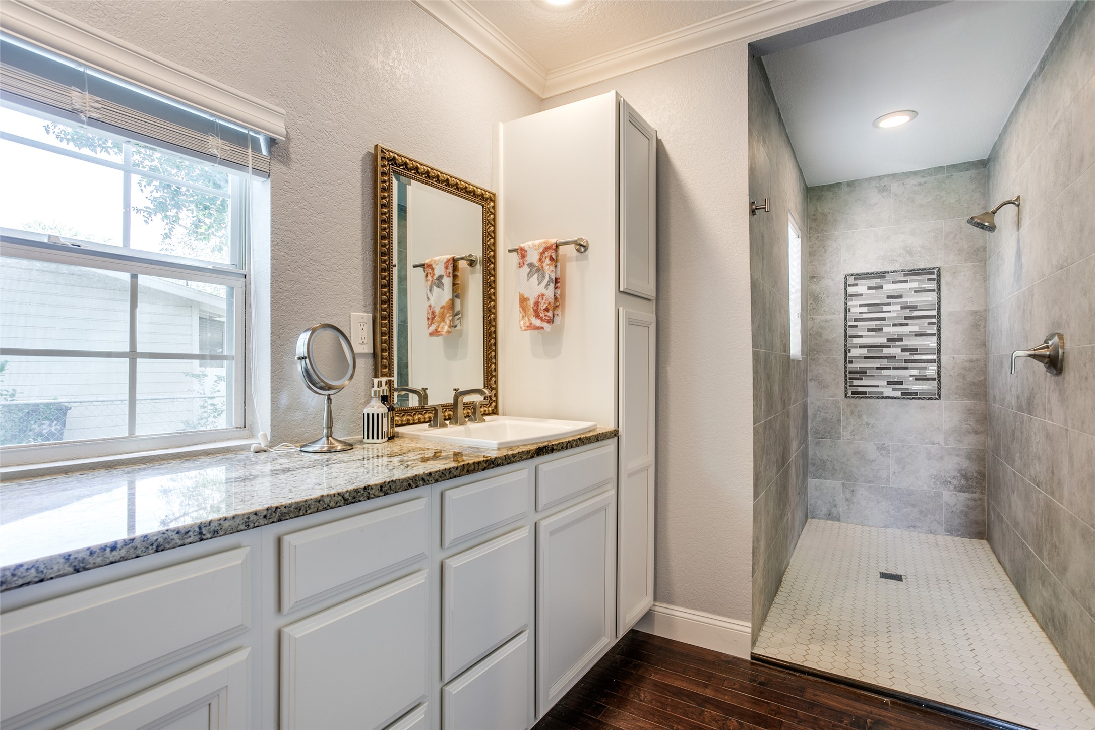 332 Tuttle Road Terrell Hills, TX 78209 - Photo 18 of 25 a bathroom with a shower sink and mirror