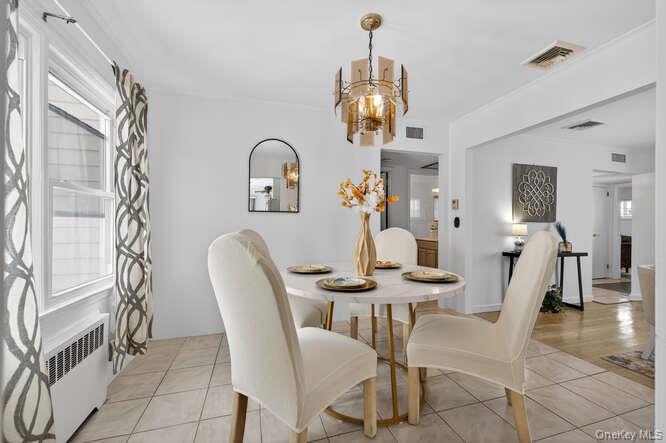 1075 Olympia Road North Bellmore, NY 11710 - Photo 10 of 23 Dining flow to living room