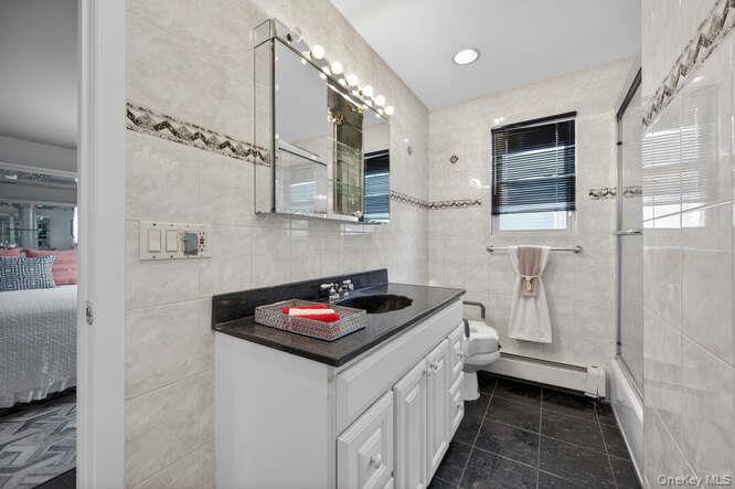 1075 Olympia Road North Bellmore, NY 11710 - Photo 14 of 23 Primary bath with tub and shower