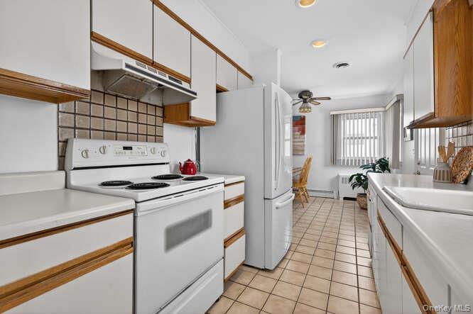 1075 Olympia Road North Bellmore, NY 11710 - Photo 5 of 23 Double galley kitchen