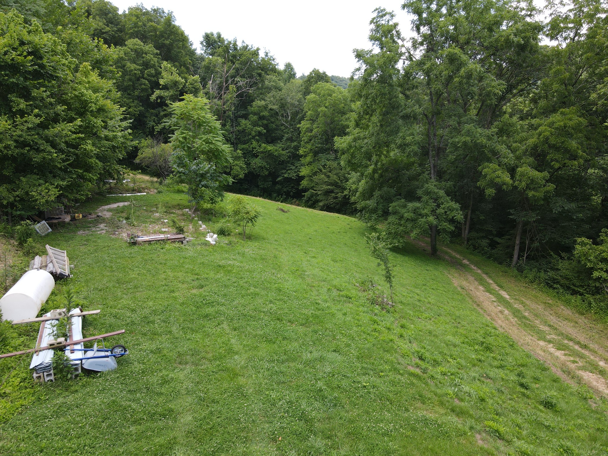 391 Difficult Road Pleasant Shade, TN 37145 - Photo 12 of 28 a backyard of a house with table and chairs