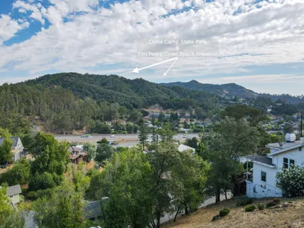 an aerial view of a house with a lake view