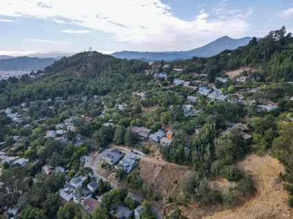 an aerial view of residential house and sandy dunes