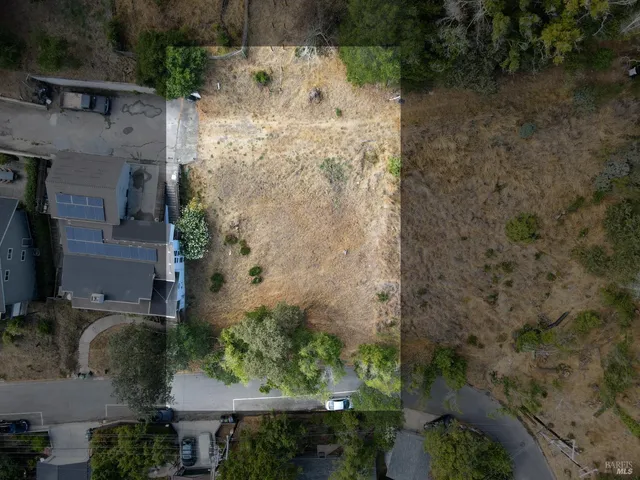 an aerial view of a city with lots of residential buildings