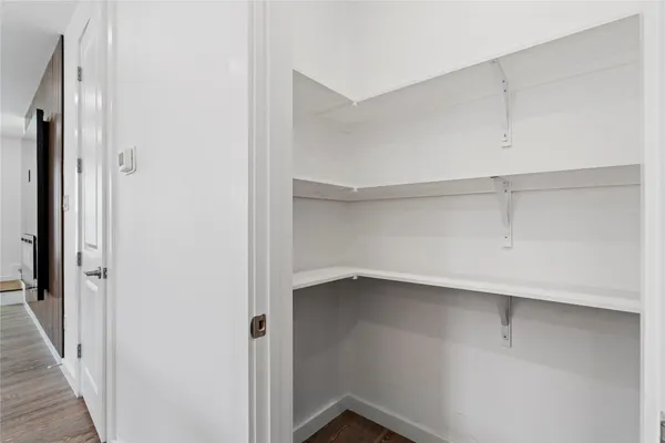 a view of an empty walk in closet