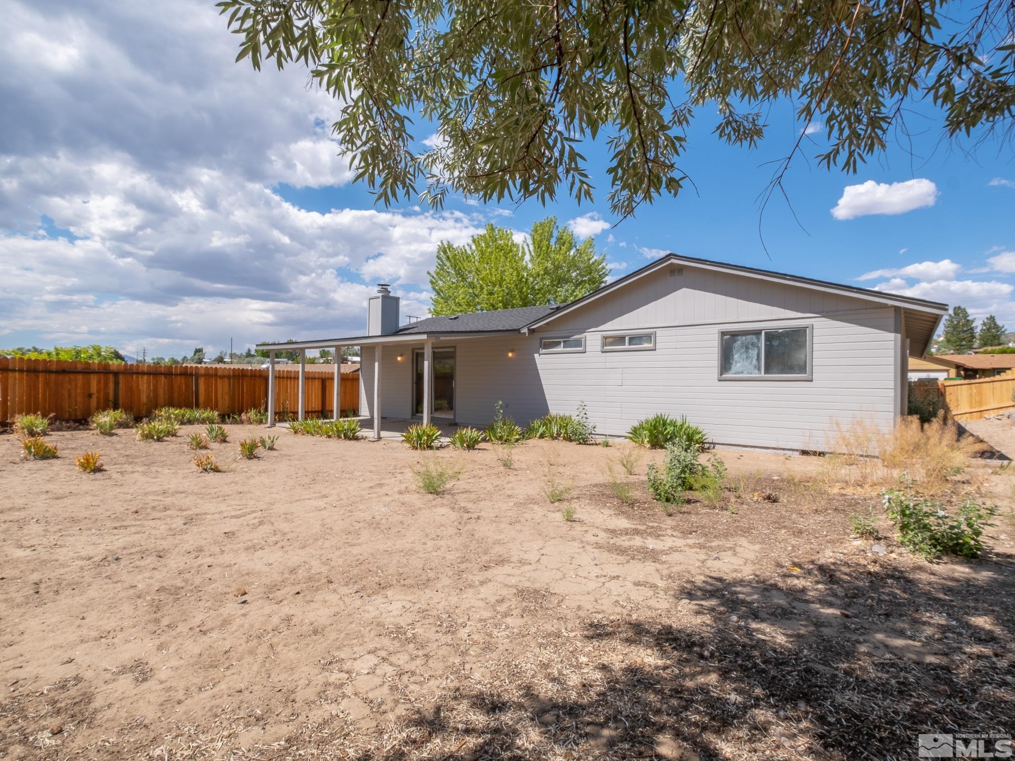 15025 Perlite Drive Reno, NV 89521 - Photo 21 of 24 a view of a house with wooden fence