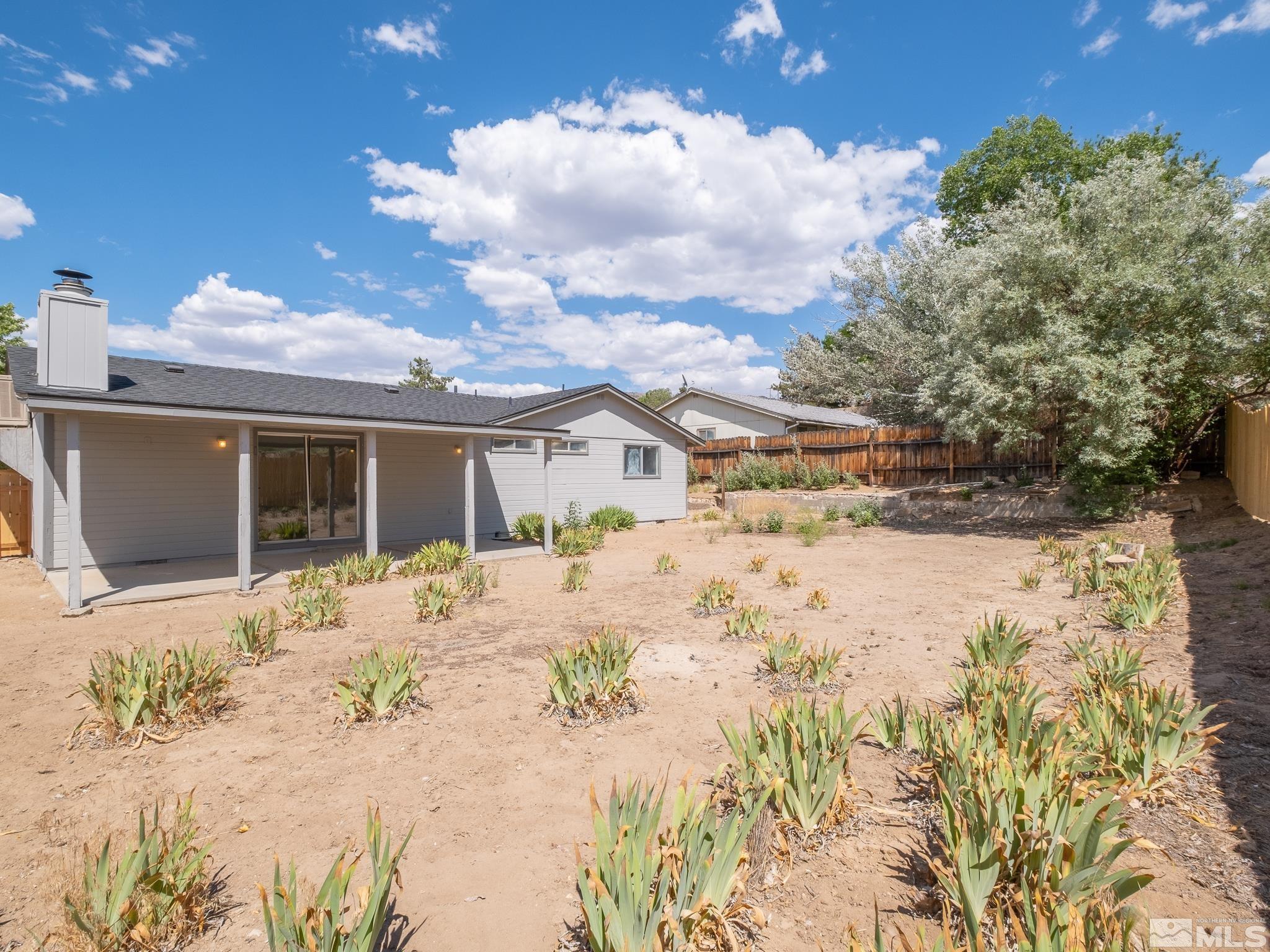 15025 Perlite Drive Reno, NV 89521 - Photo 22 of 24 a front view of a house with a yard