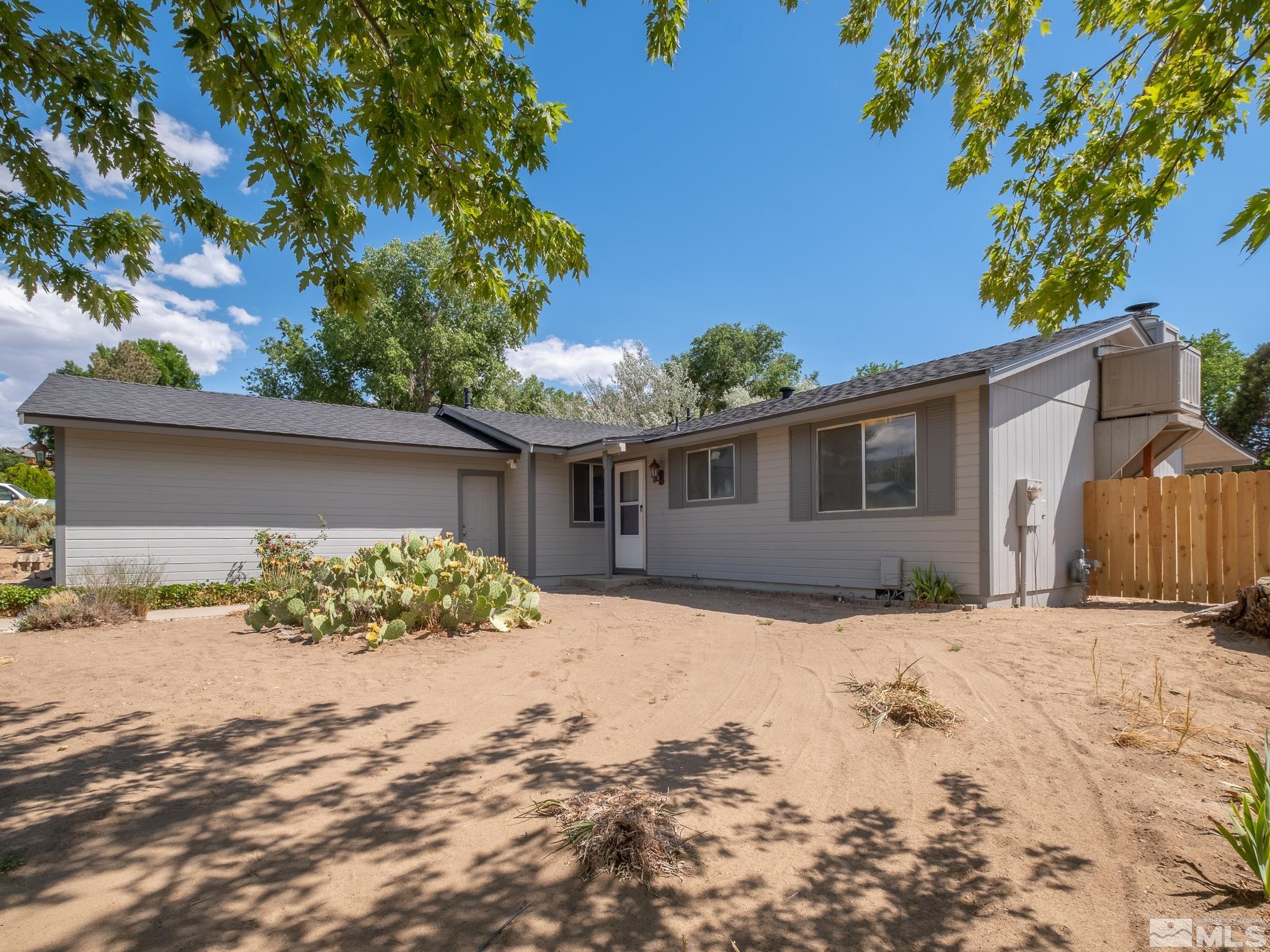 15025 Perlite Drive Reno, NV 89521 - Photo 24 of 24 a front view of a house with a yard covered in snow