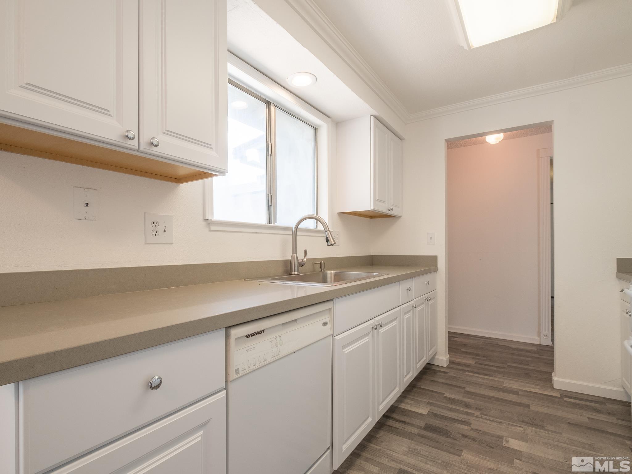 15025 Perlite Drive Reno, NV 89521 - Photo 7 of 24 a kitchen with sink cabinets and window