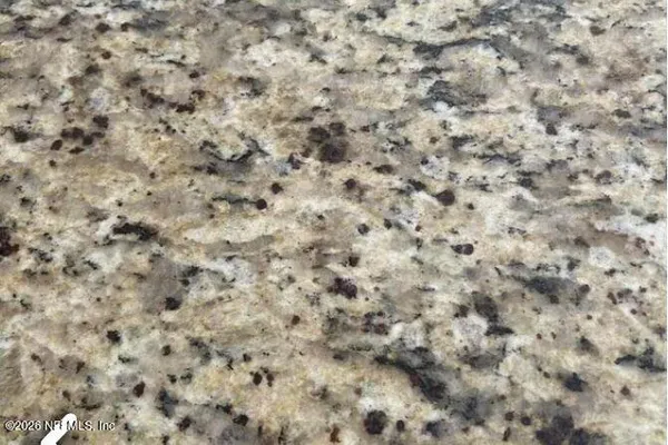 a close up of a white marble wall