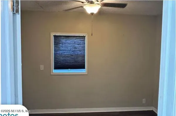 a view of a small space with a fan