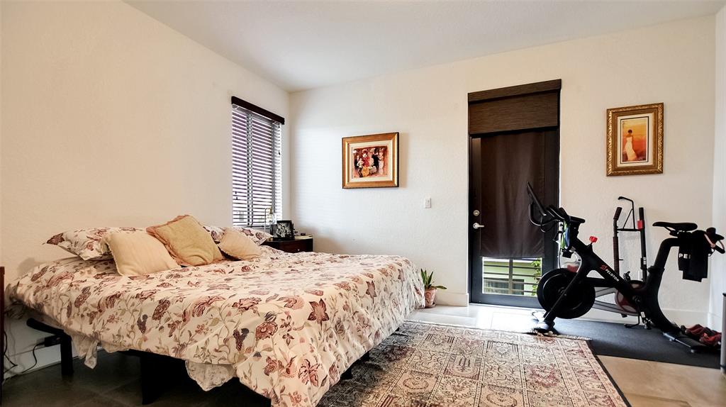 542 Southwest 91st Court, Unit 542 Miami, FL 33174 - Photo 12 of 33 a bed room with a bed and a window