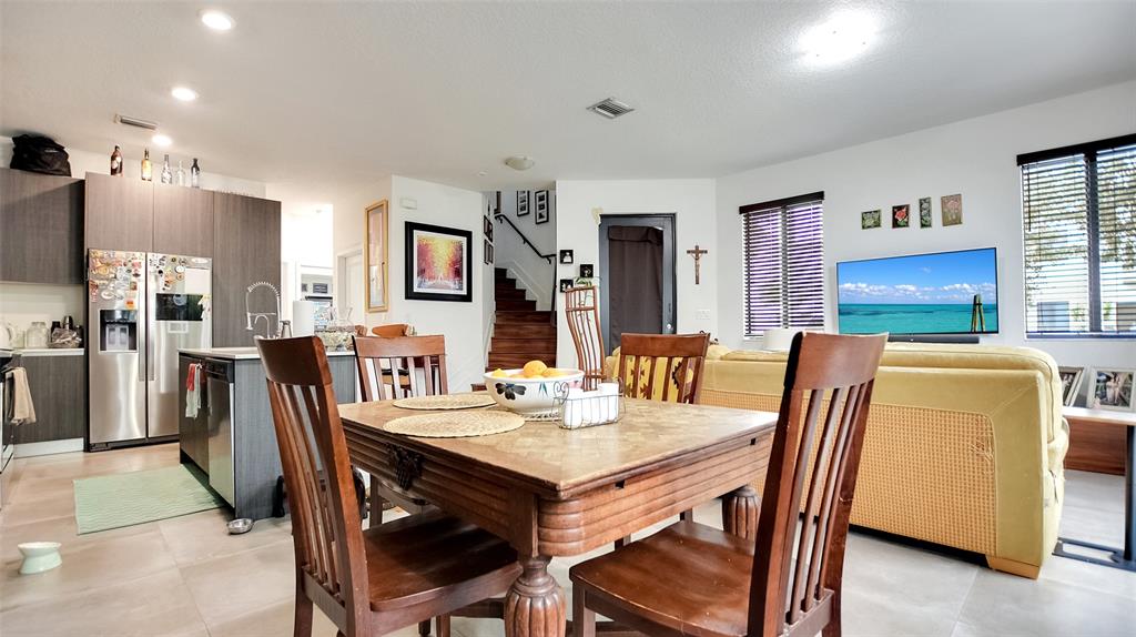 542 Southwest 91st Court, Unit 542 Miami, FL 33174 - Photo 8 of 33 a dining room with furniture and window