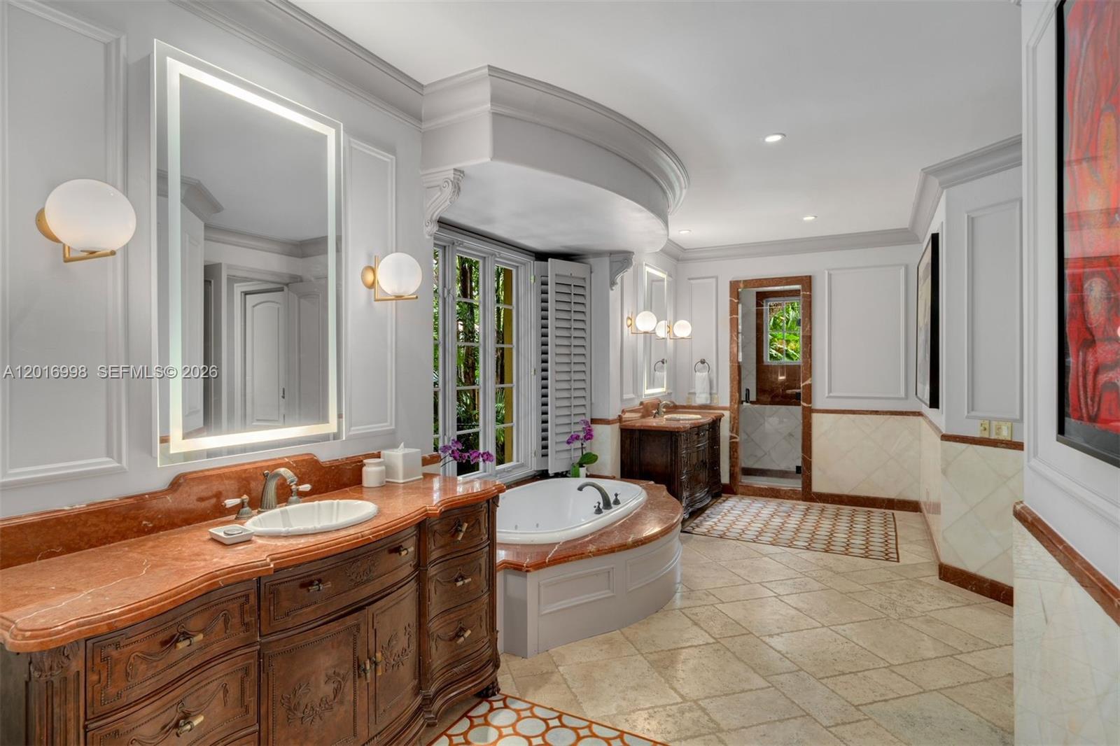 4790 Southwest 78th Street Miami, FL 33143 - Photo 9 of 33 a spacious bathroom with a tub sink and mirror