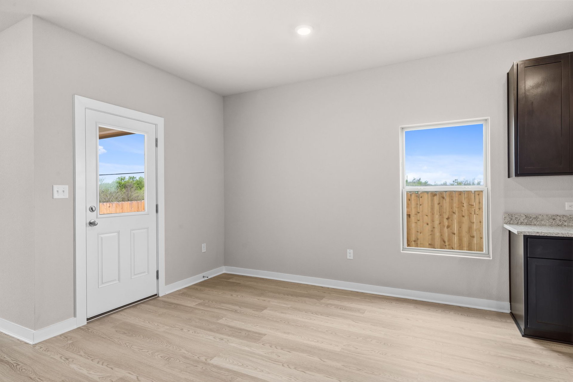 25517 Ashton Look Drive Elgin, TX 78621 - Photo 13 of 34 an empty room with windows and fireplace
