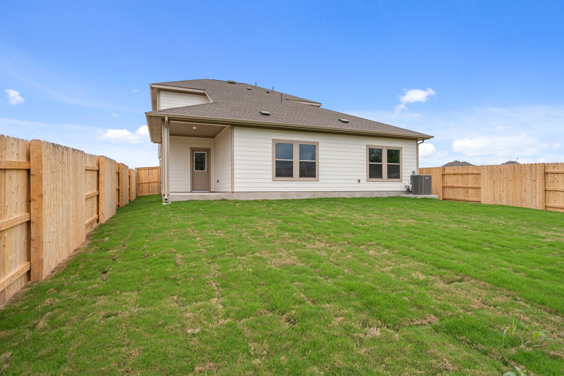 25517 Ashton Look Drive Elgin, TX 78621 - Photo 27 of 34 a front view of house with yard and green space