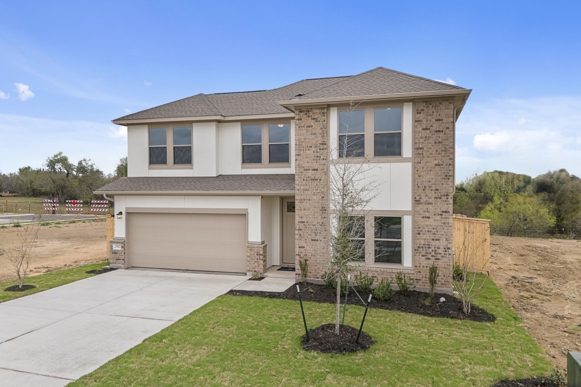 25517 Ashton Look Drive Elgin, TX 78621 - Photo 4 of 34 a front view of a house with a yard