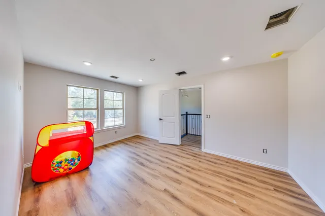 a view of an entryway with wooden floor
