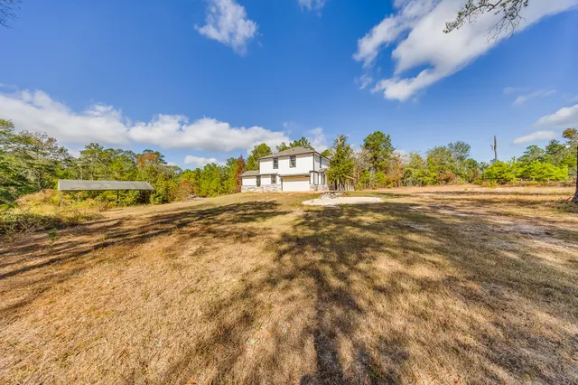 a view of a field with an ocean