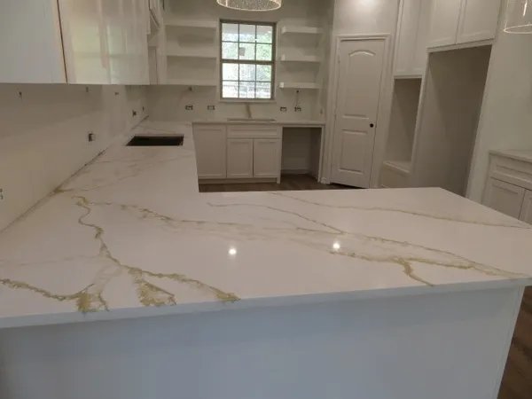 a kitchen with a stove and cabinets