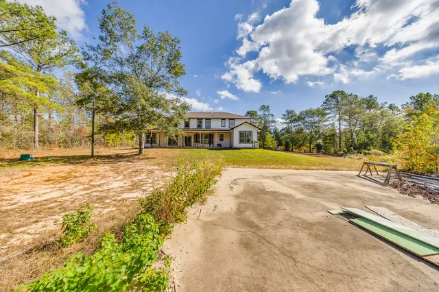 a view of a swimming pool with an outdoor space and seating area