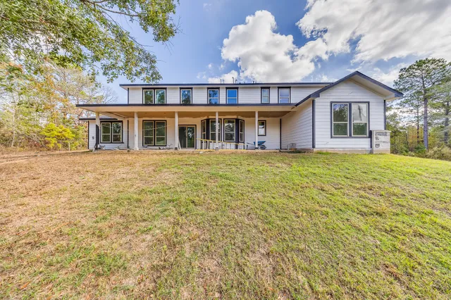 front view of a house with a big yard