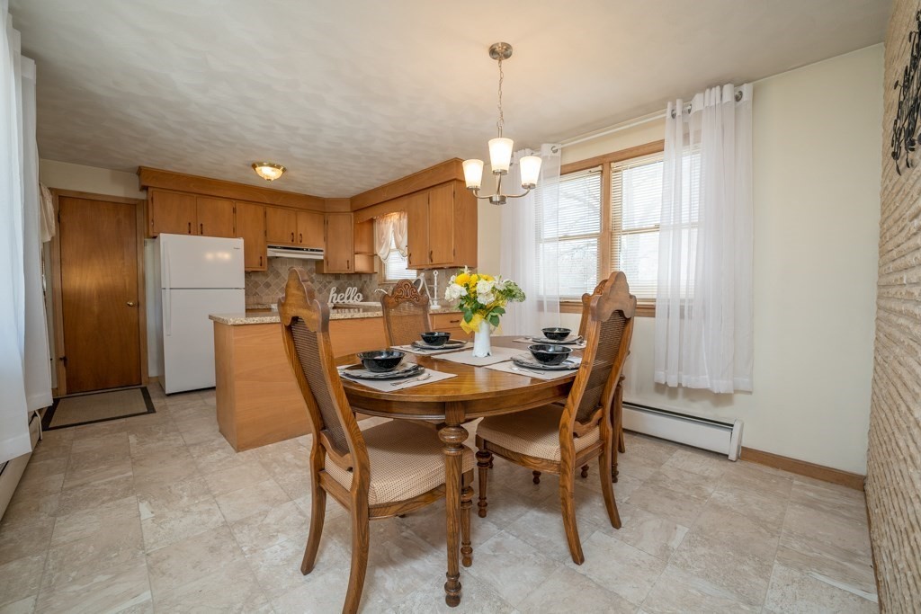 178 West Autumn Road West Springfield, MA 01089 - Photo 6 of 38 a dining room with furniture a chandelier and window