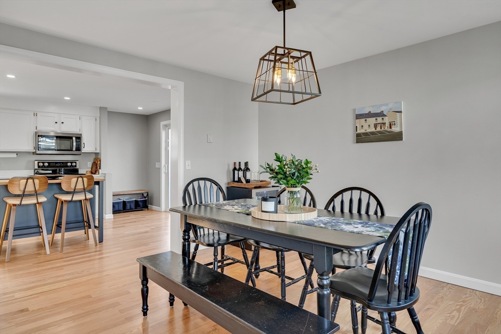 7 Long Terrace Boston, MA 02132 - Photo 11 of 42 a view of a dining room with furniture wooden floor and chandelier