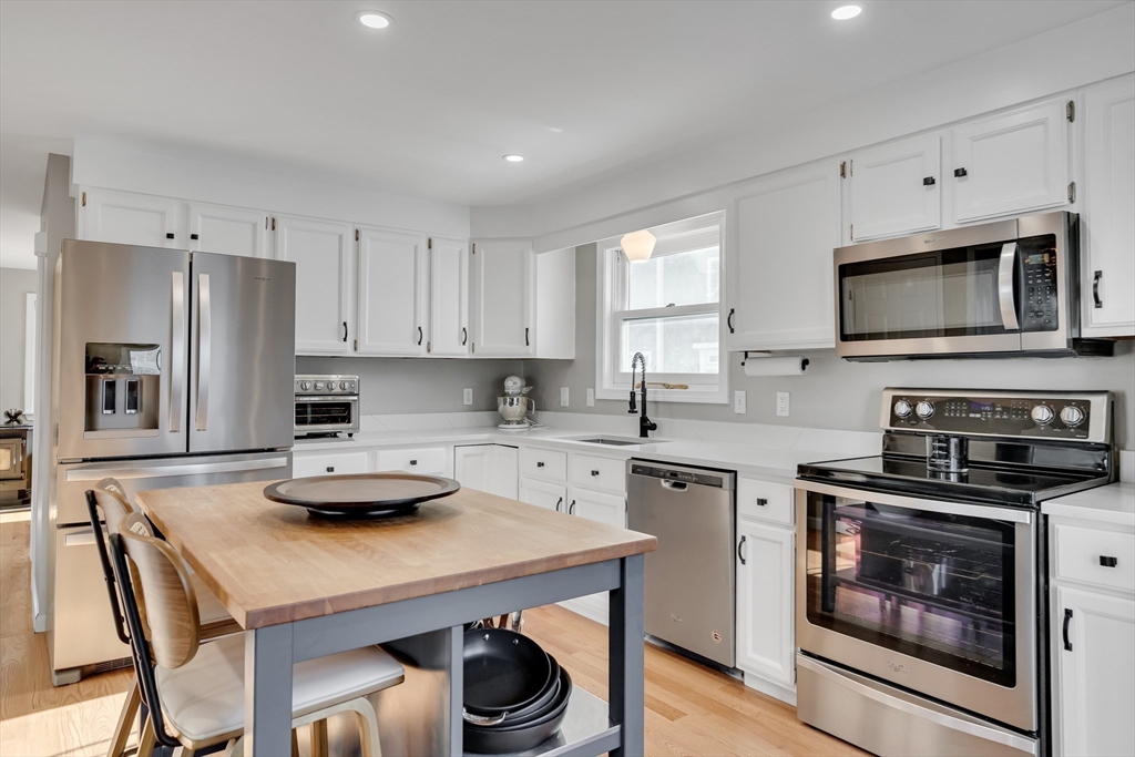 7 Long Terrace Boston, MA 02132 - Photo 13 of 42 a kitchen with a stove a sink and a microwave