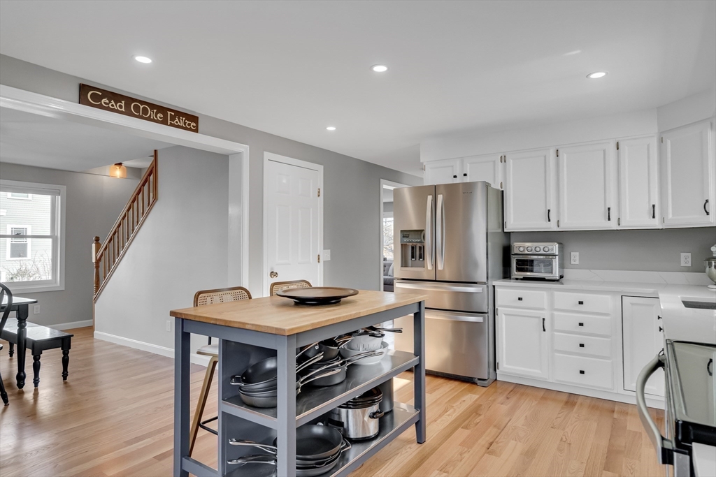 7 Long Terrace Boston, MA 02132 - Photo 15 of 42 a kitchen with wooden cabinets and stainless steel appliances