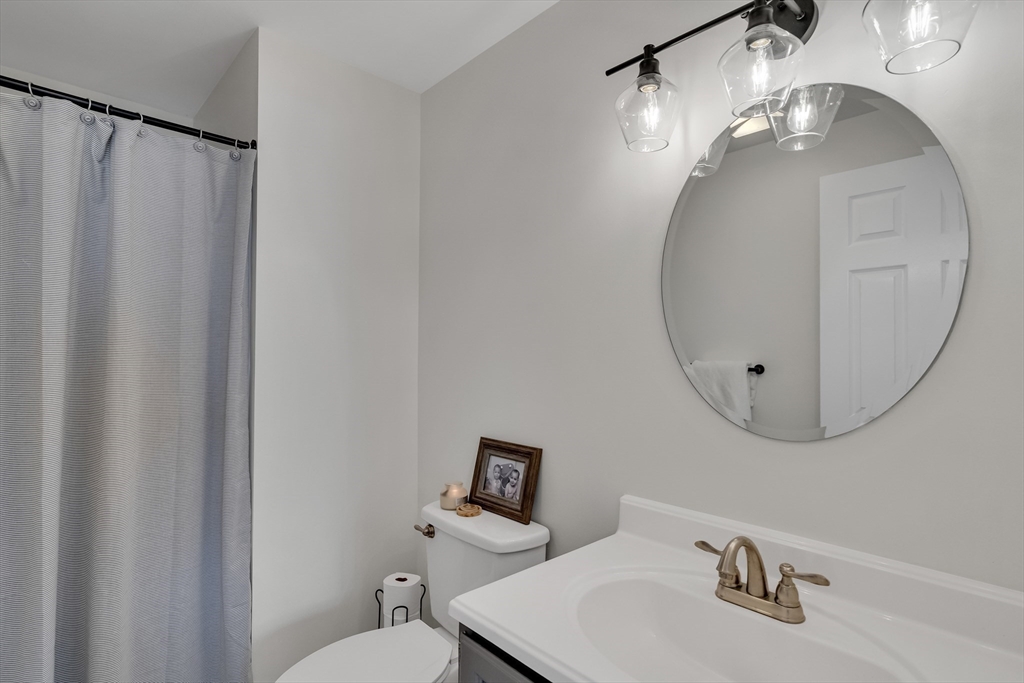 7 Long Terrace Boston, MA 02132 - Photo 21 of 42 a bathroom with a sink mirror and toilet