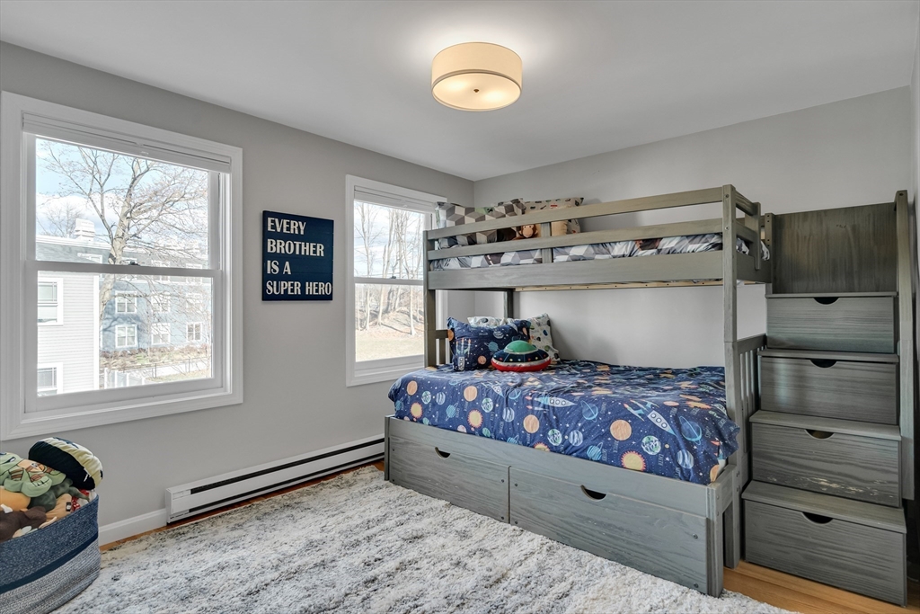 7 Long Terrace Boston, MA 02132 - Photo 23 of 42 a bedroom with a bed and a window