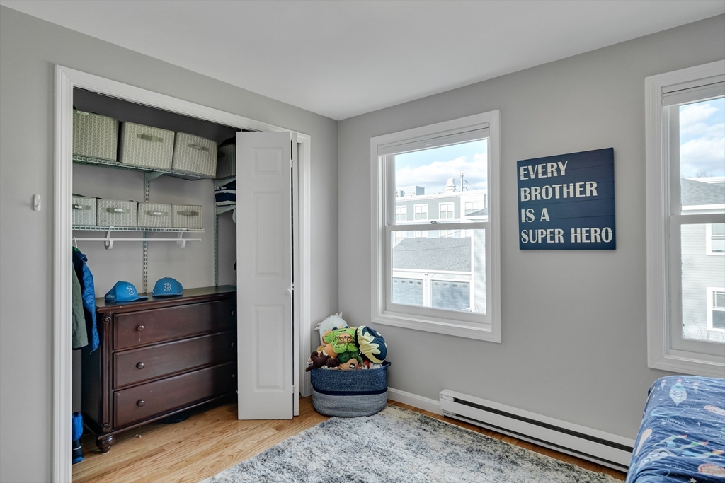7 Long Terrace Boston, MA 02132 - Photo 24 of 42 a bedroom with a bed and a window