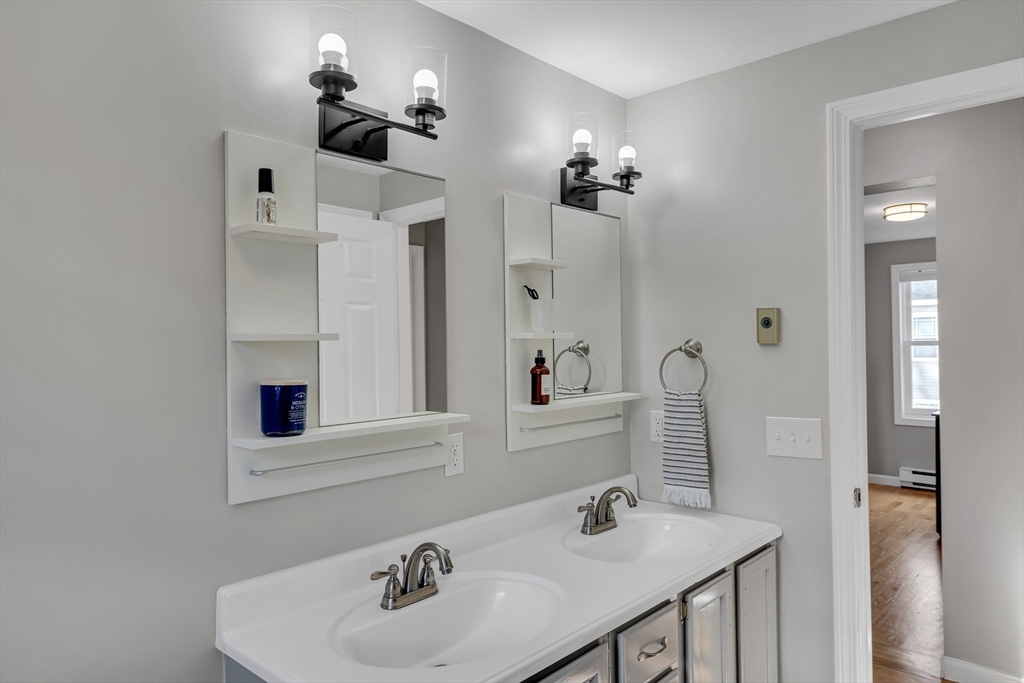 7 Long Terrace Boston, MA 02132 - Photo 29 of 42 a bathroom with a sink vanity and a mirror
