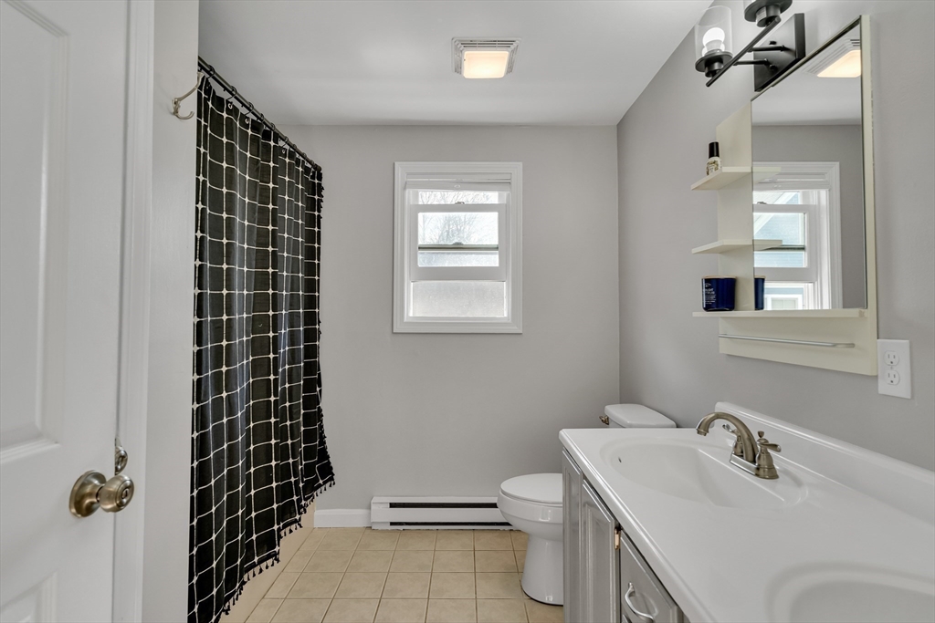 7 Long Terrace Boston, MA 02132 - Photo 30 of 42 a bathroom with a sink toilet and shower